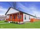 Beautifully renovated home with a fresh exterior and lush green lawn at 2428 N Gale St, Indianapolis, IN 46218