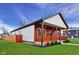 Well-maintained home featuring new exterior paint, a cozy porch, and a manicured lawn at 2428 N Gale St, Indianapolis, IN 46218
