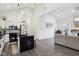 Contemporary kitchen with white cabinets, black hardware, and modern finishes with lots of light at 2428 N Gale St, Indianapolis, IN 46218