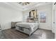 Relaxing main bedroom with tray ceiling, light wood accents, and natural light from many windows at 2428 N Gale St, Indianapolis, IN 46218