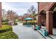 Inviting back patio with a stone deck, outdoor dining area, lounge chairs, and manicured landscaping at 290 Breakwater Dr, Fishers, IN 46037