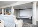 Home theater with plush seating and a large screen in the finished basement at 290 Breakwater Dr, Fishers, IN 46037