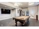 Basement rec room featuring a pool table, large screen television, and neutral color palette at 290 Breakwater Dr, Fishers, IN 46037