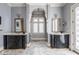 Elegant bathroom featuring dual vanities, marble flooring, and refined finishes at 290 Breakwater Dr, Fishers, IN 46037