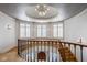 Bright foyer featuring a curved staircase, decorative lighting, and beautiful architectural details at 290 Breakwater Dr, Fishers, IN 46037