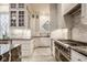Well-appointed kitchen featuring white cabinets, stainless steel appliances, and stylish backsplash at 290 Breakwater Dr, Fishers, IN 46037