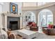 Bright living room featuring a fireplace and arched openings, perfect for relaxation at 290 Breakwater Dr, Fishers, IN 46037