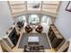 Open-concept living room featuring fireplace, piano, and ample natural light at 290 Breakwater Dr, Fishers, IN 46037