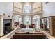 Grand living room with soaring ceilings, fireplace, and stylish furnishings at 290 Breakwater Dr, Fishers, IN 46037