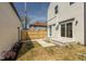 Backyard with new fencing, a small patio, and modern siding on the home at 315 E Minnesota St, Indianapolis, IN 46225