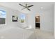 Serene bedroom with a ceiling fan, carpet, and views of the neighborhood at 315 E Minnesota St, Indianapolis, IN 46225