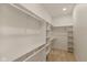 Bright walk-in closet with adjustable shelving and ample storage space for clothes and accessories at 315 E Minnesota St, Indianapolis, IN 46225