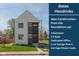 New construction featuring a modern elevation, showcasing a light gray exterior and a well-manicured lawn at 315 E Minnesota St, Indianapolis, IN 46225