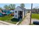 Modern two story home with professionally landscaped lawn and dark design accents at 315 E Minnesota St, Indianapolis, IN 46225