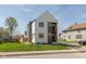 Contemporary two-story home with light siding, dark accents, and a well-maintained front lawn at 315 E Minnesota St, Indianapolis, IN 46225