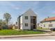Modern two story home with light colored siding, dark accents, and professionally landscaped lawn at 315 E Minnesota St, Indianapolis, IN 46225
