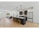 Modern kitchen featuring a large island with seating, stainless steel appliances, and an open-concept design at 315 E Minnesota St, Indianapolis, IN 46225