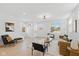 Open-concept living room with hardwood floors, bright windows, and modern furnishings and decor at 315 E Minnesota St, Indianapolis, IN 46225
