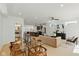 Open-concept living space with a modern kitchen, comfortable living area, and stylish dining set for seamless entertaining at 315 E Minnesota St, Indianapolis, IN 46225