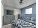 Modern bedroom showcasing coordinated furniture, neutral colors, new lighting, and stylish decor at 334 N Chester Ave, Indianapolis, IN 46201