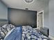 Comfortable bedroom featuring coordinated furniture, neutral colors, new lighting, and stylish decor at 334 N Chester Ave, Indianapolis, IN 46201