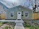 Charming home featuring a freshly painted exterior, new walkway, and manicured landscaping, creating curb appeal at 334 N Chester Ave, Indianapolis, IN 46201