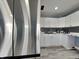 Newly remodeled kitchen featuring stainless steel appliances, crisp white cabinets, and designer backsplash at 334 N Chester Ave, Indianapolis, IN 46201