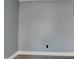 Neutral room with grey walls, a white trim, and durable flooring providing a blank canvas for new owners at 334 N Chester Ave, Indianapolis, IN 46201