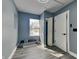 Bright room with neutral walls, hardwood floors, and a window, offering versatility for various uses at 334 N Chester Ave, Indianapolis, IN 46201