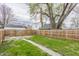 Spacious backyard showcasing lush green grass and a wooden fence, offering privacy and room for outdoor activities at 341 Sanders St, Indianapolis, IN 46225