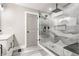Elegant bathroom featuring a walk-in shower with black hardware, sleek vanity and stylish tiling at 341 Sanders St, Indianapolis, IN 46225