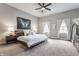 Spacious bedroom featuring a ceiling fan, soft carpet, large windows and natural light at 341 Sanders St, Indianapolis, IN 46225