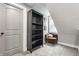 Bonus room featuring a bookshelf and comfortable chair next to a window at 341 Sanders St, Indianapolis, IN 46225