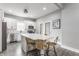 Bright kitchen featuring white cabinetry, stainless appliances, a large island, and barstool seating at 341 Sanders St, Indianapolis, IN 46225