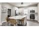 Kitchen features modern white cabinets, stainless steel appliances, quartz counters, and a breakfast bar at 341 Sanders St, Indianapolis, IN 46225