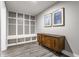 Mudroom featuring built-in shelving with hooks, a wooden console table, and stylish decor at 341 Sanders St, Indianapolis, IN 46225