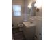 A bright and well-maintained bathroom features modern fixtures and classic tile work at 3505 N Layman Ave, Indianapolis, IN 46218