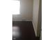 Bedroom featuring a window and dark hardwood floors at 3505 N Layman Ave, Indianapolis, IN 46218