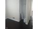 Bedroom with dark hardwood floors, closet, and white trim at 3505 N Layman Ave, Indianapolis, IN 46218