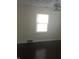 Bedroom with hardwood floors, a window, and ceiling fan at 3505 N Layman Ave, Indianapolis, IN 46218