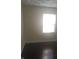 Bedroom with dark hardwood floors and a window at 3505 N Layman Ave, Indianapolis, IN 46218