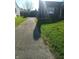 View of a driveway leading up to a house with a garage in the background at 3505 N Layman Ave, Indianapolis, IN 46218