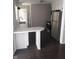 Clean kitchen with stainless steel appliances, dark floors, and a breakfast bar at 3505 N Layman Ave, Indianapolis, IN 46218
