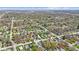 Expansive aerial view of a suburban neighborhood with lush greenery and well-spaced homes at 3624 Wallace Ave, Indianapolis, IN 46218