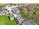 Aerial view of a home showcasing the yard, detached garage, and surrounding neighborhood at 3624 Wallace Ave, Indianapolis, IN 46218
