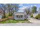 Charming bungalow with gray siding, crisp white trim, and a cozy front porch at 3624 Wallace Ave, Indianapolis, IN 46218