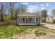 Charming bungalow with gray siding, crisp white trim, and a cozy front porch at 3624 Wallace Ave, Indianapolis, IN 46218