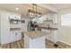 Modern kitchen featuring white cabinets, granite countertops and an island with stainless steel appliances at 3624 Wallace Ave, Indianapolis, IN 46218