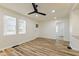 Bright room with wood floors, white walls, and a view to the adjacent rooms at 3624 Wallace Ave, Indianapolis, IN 46218