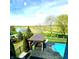 Aerial view of backyard featuring pool, covered patio, and golf course at 4414 Hickory Grove Blvd, Greenwood, IN 46143